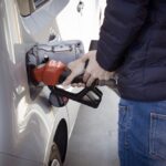 man filling up his gas tank