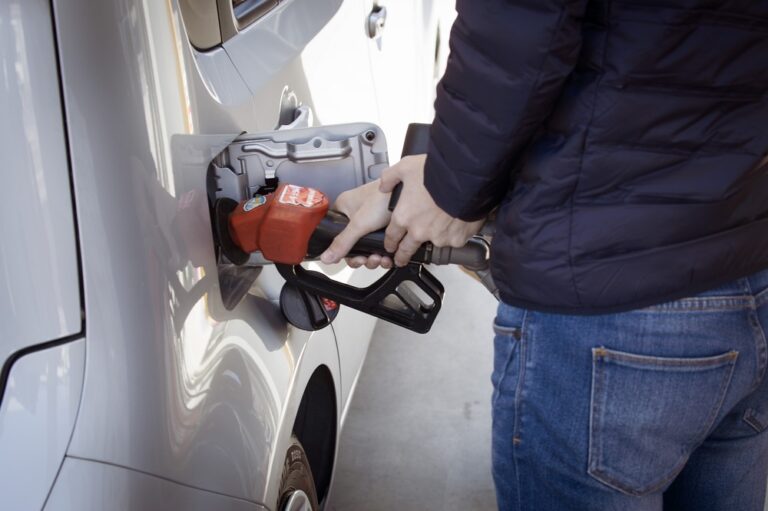 man filling up his gas tank